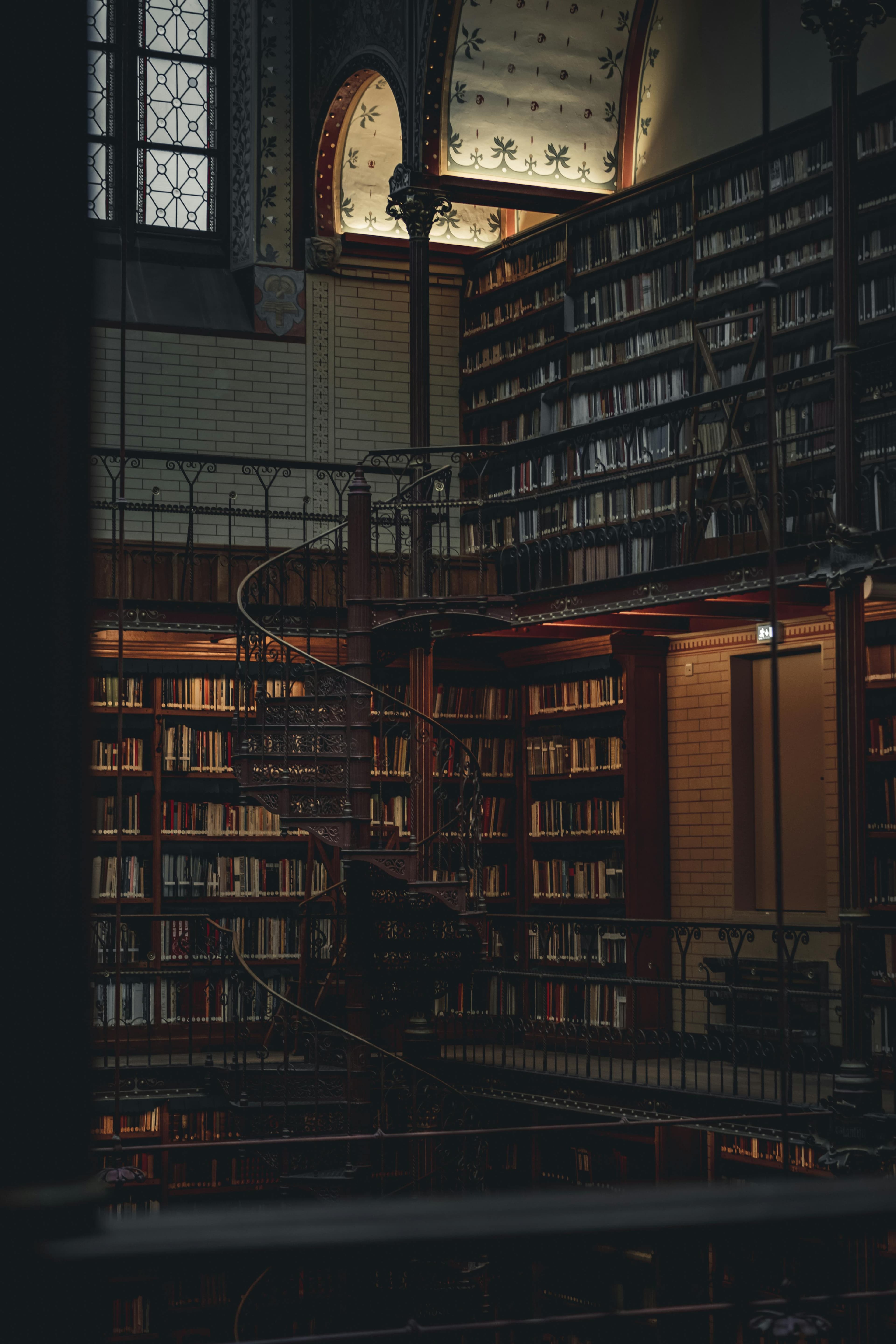 A dim old library with warm light